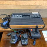 Atari 2600 Console(w/1Joystick, 1set of paddles, Power Adapter, Coaxial Adapter)